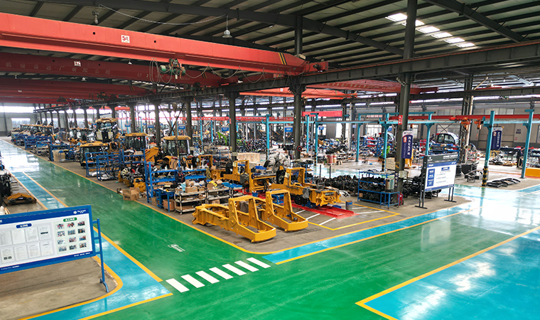 Construction machinery factory workshop with wheel loaders